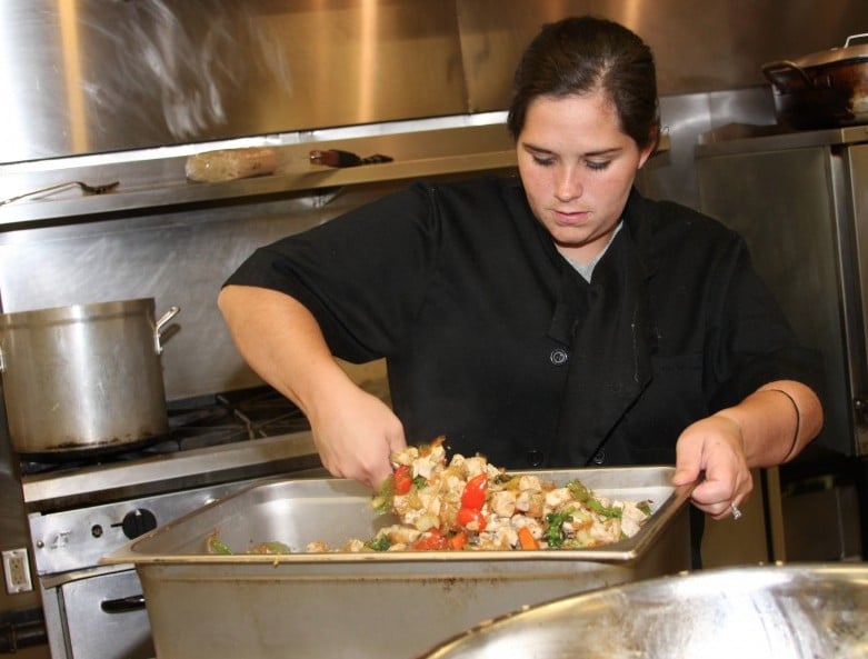 BRIGHTON PREPARING FOOD IN KITCHEN