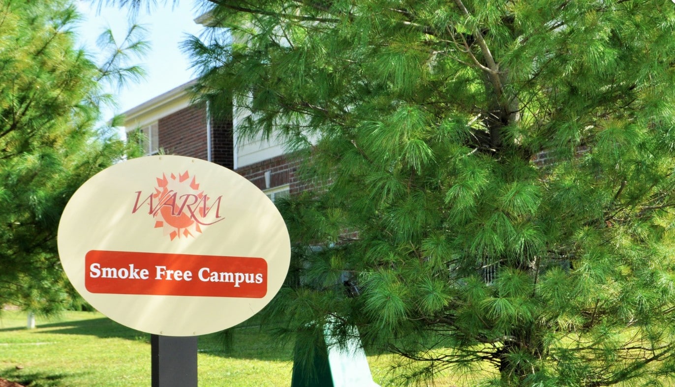 WARM SMOKE-FREE SIGN OUTSIDE RECOVERY CENTER
