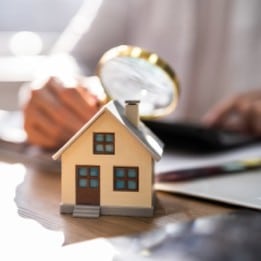 HOUSE UNDER MAGNIFYING GLASS